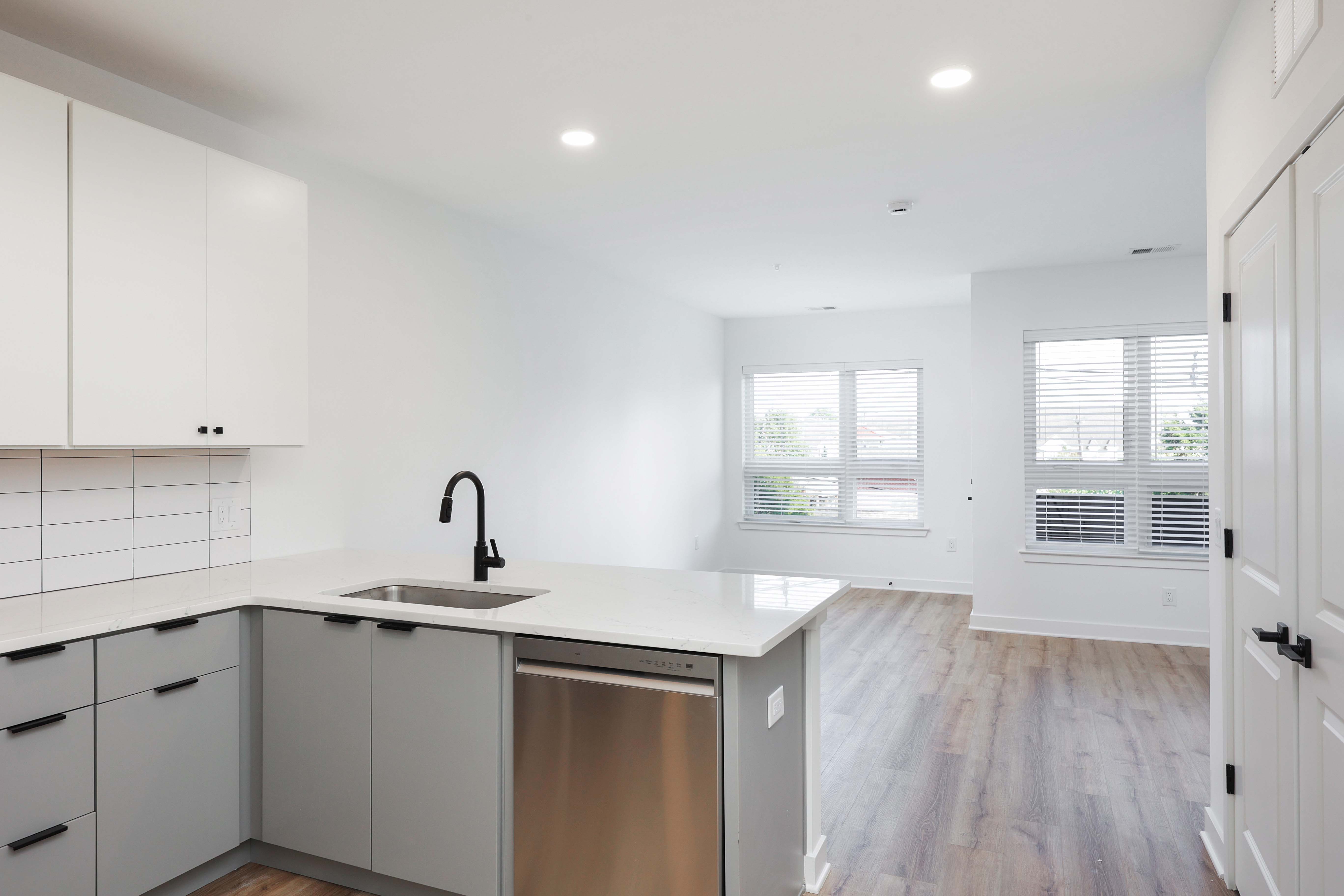 Kitchen island and living area in a studio apartment at The Arthur Carteret NJ