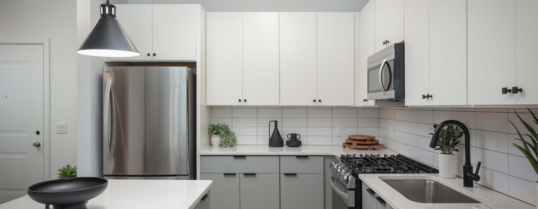 a kitchen with white cabinets
