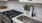 a kitchen with a sink and a plant