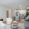 living room with couch coffee table and view of kitchen