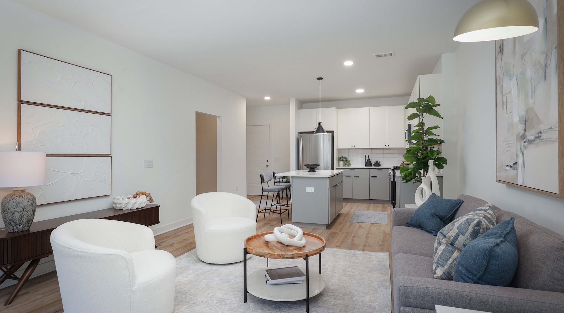 living room with couch coffee table and view of kitchen