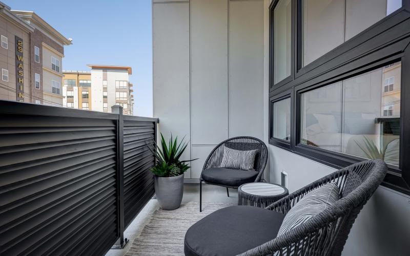 a patio with a table and chairs