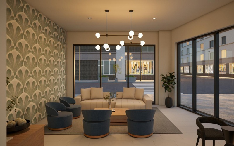 a room with a couch and chairs