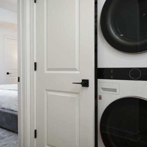 a room with a bed and a mirror