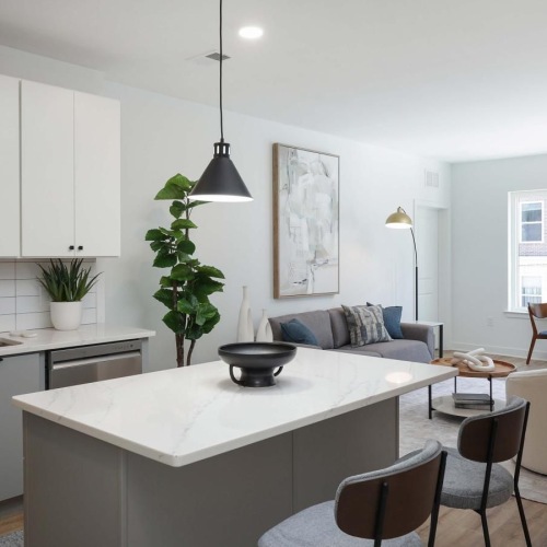 a kitchen with white cabinets