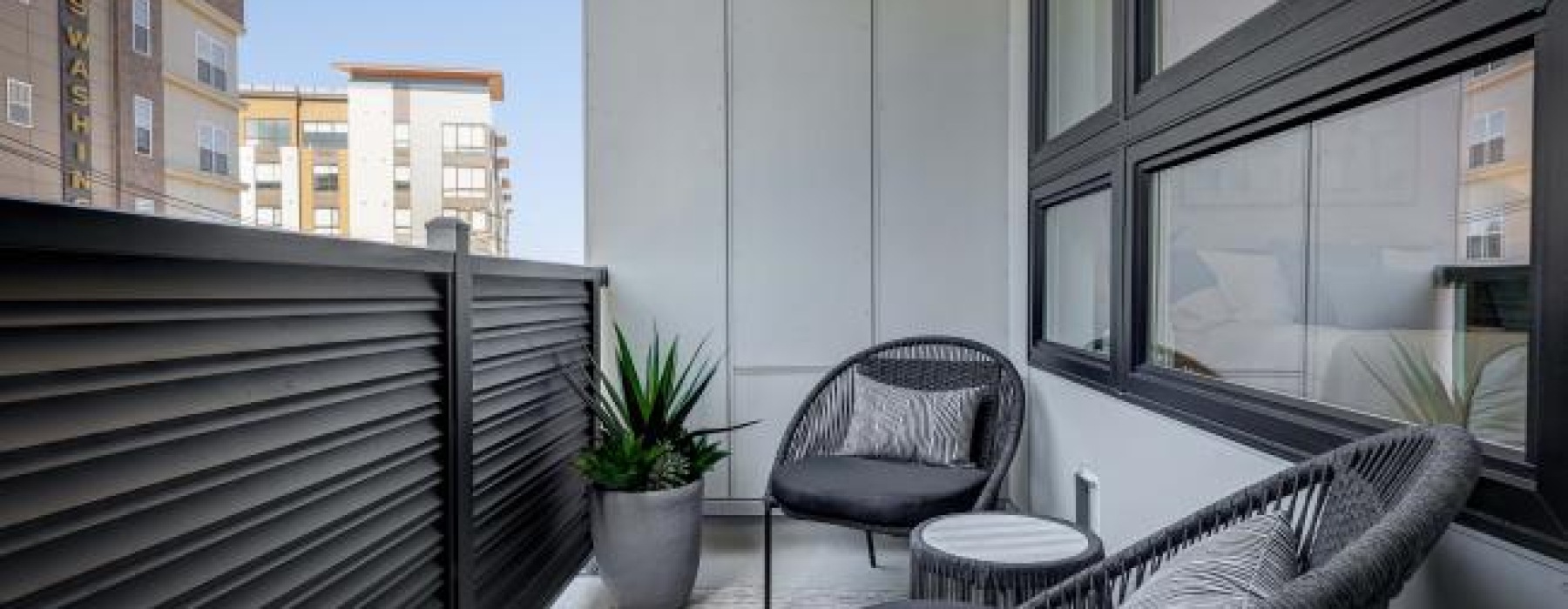 a patio with a table and chairs