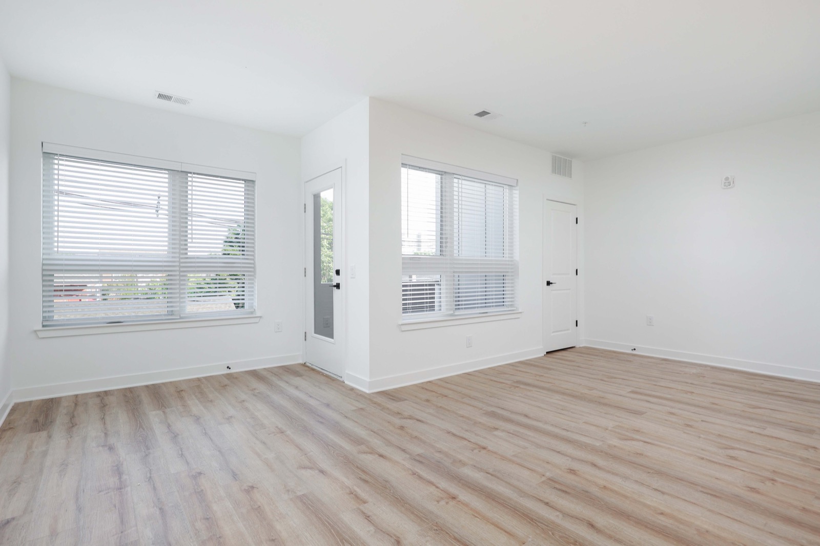 Bright living area with large windows in a Carteret NJ studio apartment